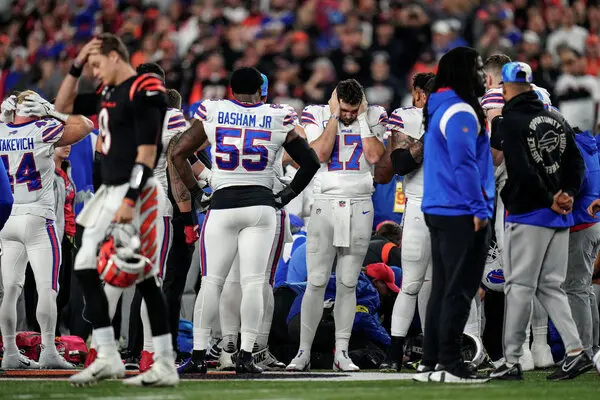 Bengals and Bills in shock as fellow player is being helped